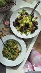 Well-balanced breakfast featuring healthy source of ptotein, fermented and fresh vegetables, salad and nuts on a plate. Top view real kitchen photo, diet and self care and love concept