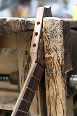 Classical guitar neck with fretboard and tuning peg holes