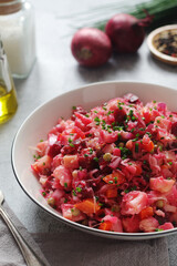 A bowl with Vinegret salad, a typical Russian dish