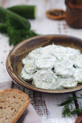 A traditional Polish salad Mizeria in rustic style