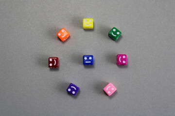 Cubes with happy faces cheer up a sad one