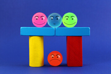Structure supports the weight of three colorful spheres and protects another angry one underneath