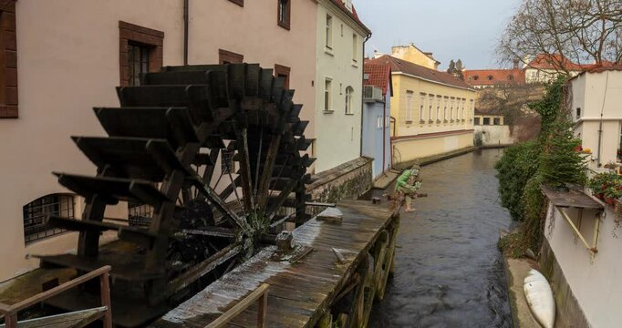 Prague, Czech Republic - December 28, 2024: "Altes Wasserrad" historic water mill in Prague. Timelapse.