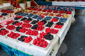 Prague, Czech Republic, August 5, 2023. A market stall selling berries: healthy and inviting looking raspberries, blackberries and blueberries are in evidence. Healthy and healthful food.