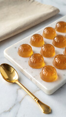 Clear Sachets with Jelly Supplements on White Marble and Gold Cutlery
