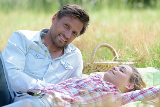 portrait of couple relaxing during picnic