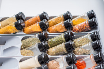 Organized Spice Drawer with Various Herbs and Seasonings