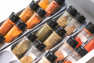 Organized Spice Drawer with Various Herbs and Seasonings