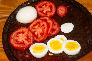 Tomato and boiled eggs , on the table