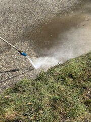 Pressure washing a driveway