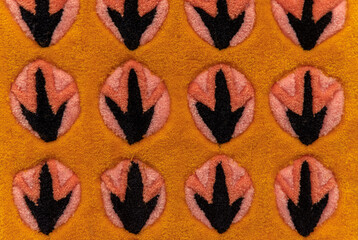 Bird footprints on soft carpet close up