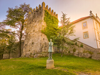 The Torres da Muralha Fernandina tower and the Arnaldo Gama statue in Porto, Portugal