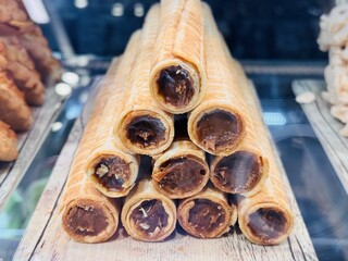 Deliciously Sweet Rolled Crispy Treats That Are Sure to Please Everyone You Serve. Indulge in these irresistibly crispy rolled sweets, which are perfect for satisfying any dessert lovers delight