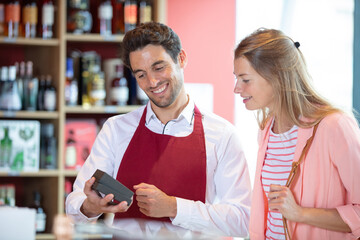 wine steward taking credit card payment