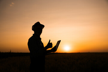 The silhouette of a farmer giving a thumbs up at sunset conveys a message of success and adaptation...
