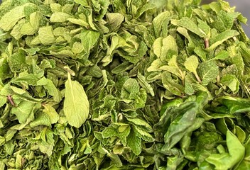 Exquisite assortment of dried herbs specifically designed for various culinary applications. This closeup image shows dried green herbs perfect for seasoning and enhancing flavors in various dishes.