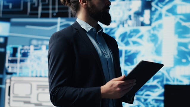 Tech savvy administrator reviewing AI brain programming on a tablet, exploring algorithmic thinking and deep learning through neural networks system. Artificial intelligence coding. Camera A.