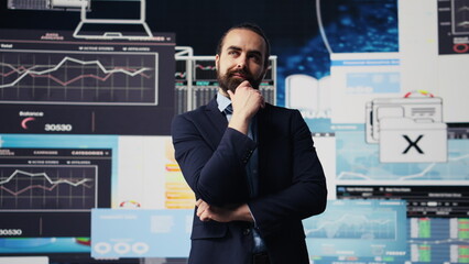 Modern business leader thinking about new successful ideas to increase his company profits, using...