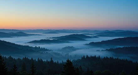 Obraz premium Misty mountain range at dawn