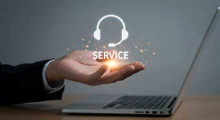 Service support assistance customer help desk communication with digital headset icon and business hand on laptop representing online customer care solution