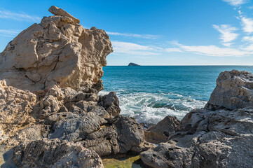 View of the Mediterranean Sea from Cala de Finestrat beach, with Benidorm Island in the background,...