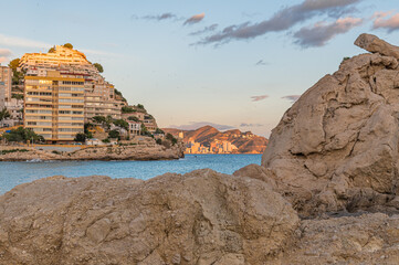 View of the beach of Cala de Finestrat at sunset, Spain