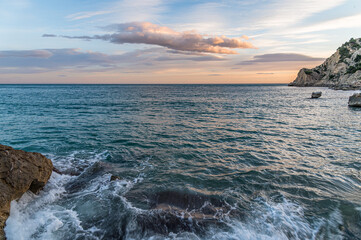 View of the beach of Cala de Finestrat at sunset, Spain