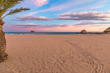 View of the beach of Cala de Finestrat at sunset, Spain