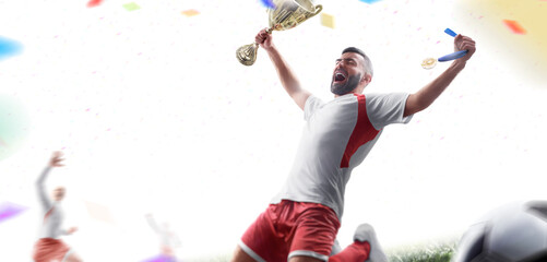 Soccer winner. Soccer player holds a cup and a medal in his hands. The football team celebrates the victory. Sport emotion. Confetti. Isolated