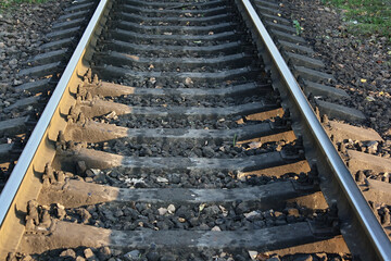 A railway track stretching into the distance, symbolizing travel, forward movement, and connection...