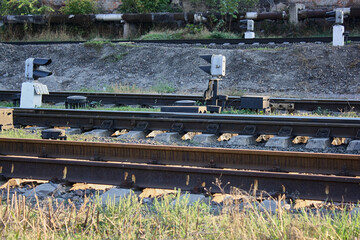 A railway track stretching into the distance, symbolizing travel, forward movement, and connection...