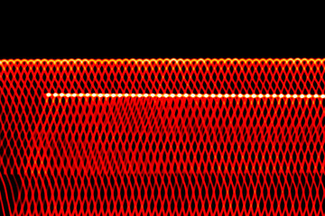 Abstract glowing red light pattern with dynamic waves and grid-like texture on black background —...
