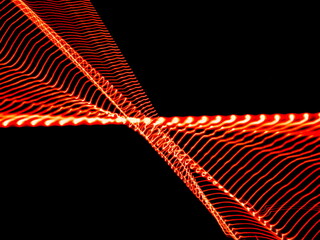 Abstract glowing red light waves in dynamic pattern on black background. Futuristic energy or...
