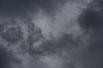 dramatic mystical stormy sky with thick gray textured clouds. artistic photo for original background, backdrop, layout or decoration