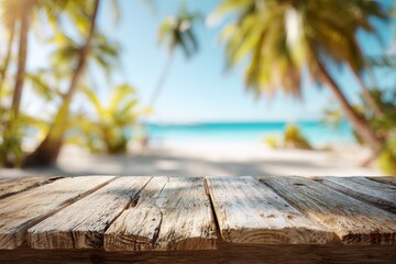 photo of rustic wooden table on foreground, blurred background of tropical beach with white sand, palm trees and blue ocean, sunny summer day, mockup for design and product display