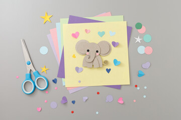 Cardboard animal cutout on paper for creative workshops, ideal for art schools, educational content, parenting blogs, craft supply stores,