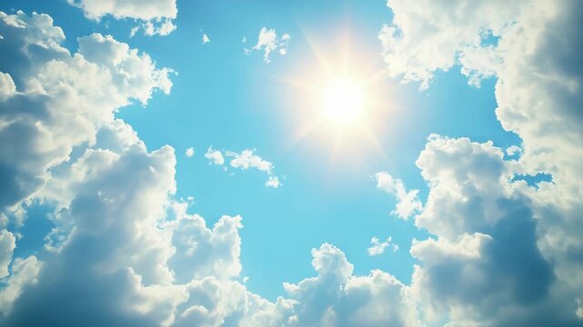 Bright sun shining through fluffy white clouds in a clear blue sky