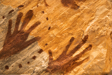 Faint handwriting on a sandstone wall in Tham Pha Thai National Park, Lampang, Thailand