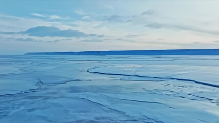 Stunning aerial view of a frozen arctic landscape featuring cracked ice formations - Powered by Adobe
