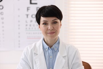 Portrait of professional ophthalmologist wearing uniform in clinic
