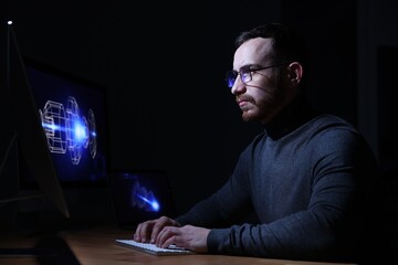 Engineer working with digital drawing at table in office