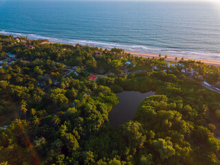 Aerial coastal view of the beaches at La Libertad, El Salvador with lagoon during a tranquil afternoon
