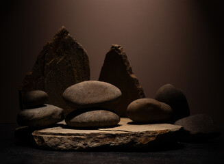 Composition with brown flat and smooth oval natural zen stones with texture for podium presentation...