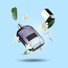 Bottle of floral perfume and jasmine flowers in air on light blue background