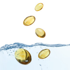 Collagen capsules falling into water on white background