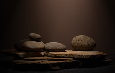 Composition with brown flat and smooth oval natural zen stones with texture for podium presentation...