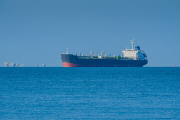 Explorer Tanker near Balikpapan Bay with Distant Oil Rigs