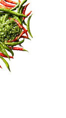 Obraz premium A vibrant display of fresh green and red chili peppers with chopped green onions on dark background