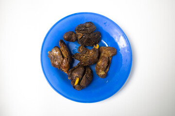 Fried chicken liver served on a blue plate