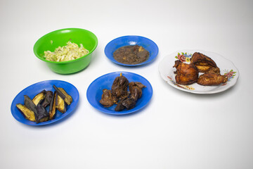 Crispy fried chicken, spicy sauce and stir-fried vegetables in a dish